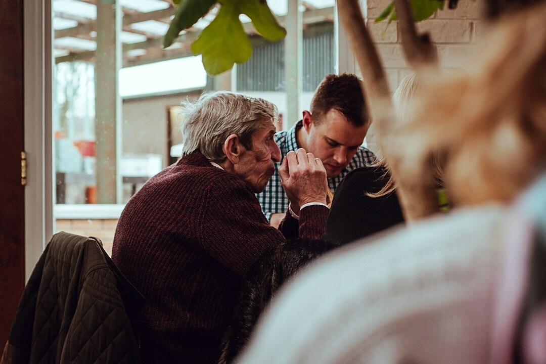 elderly man sharing story