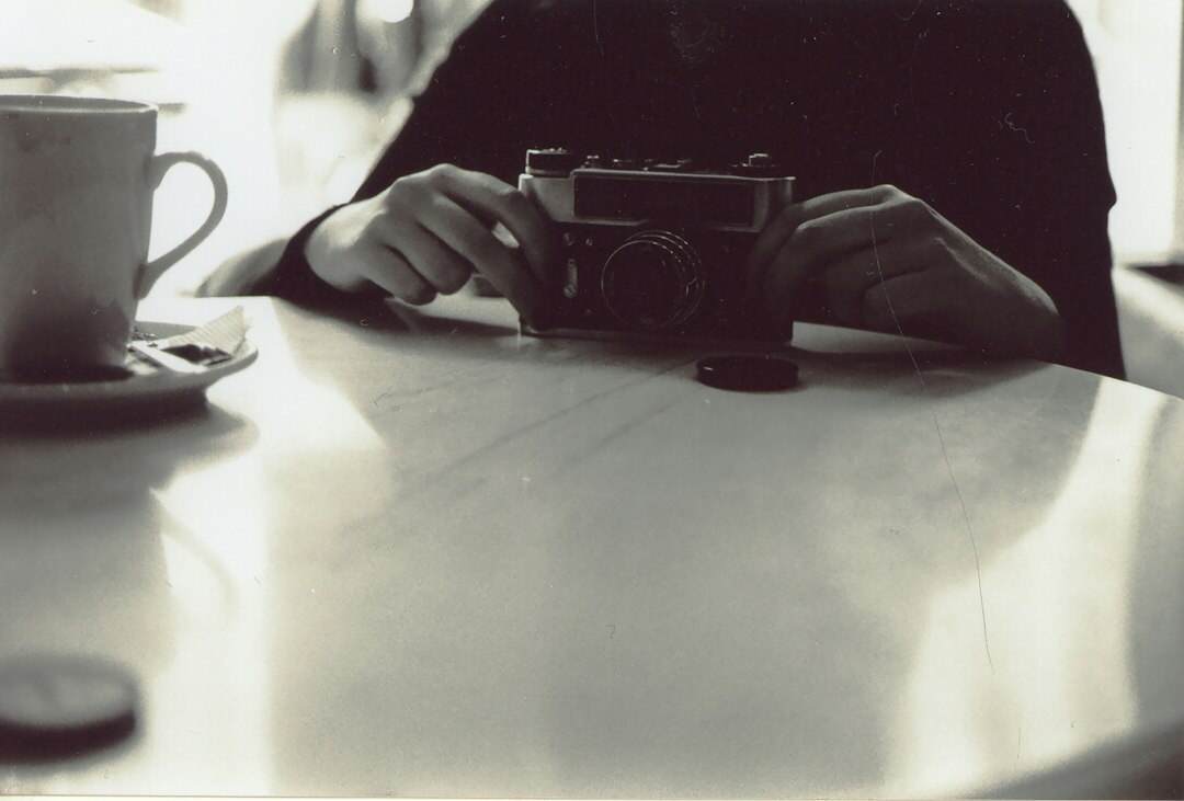 Vintage film camera resting on a wooden table