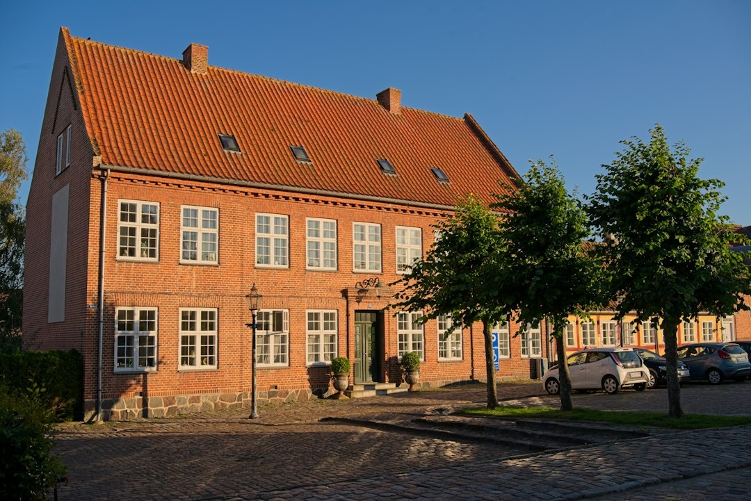 Danish town square with locals walking during golden hour